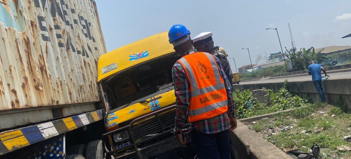 One feared dead, motorcyclist Injured as container crush bus, bike in Lagos