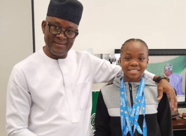 Sports Minister receives 13 year old gymnast, Stephanie Onusiriuka after winning 4gold medal at the National Youth Games